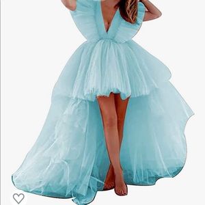 Hi low tulle dress in the light blue color.